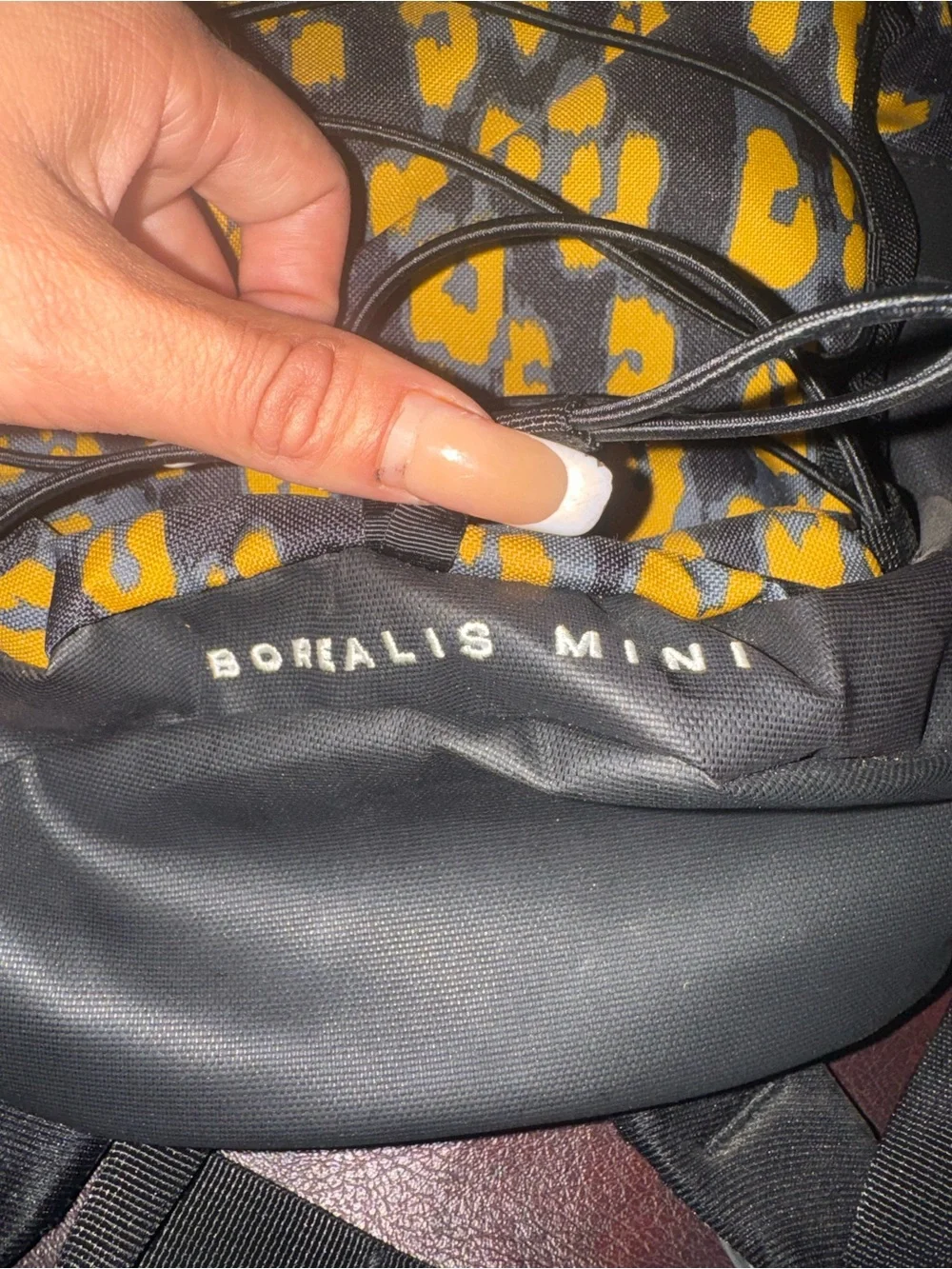 The North Face Black and Yellow Leopard Print Mini Backpack